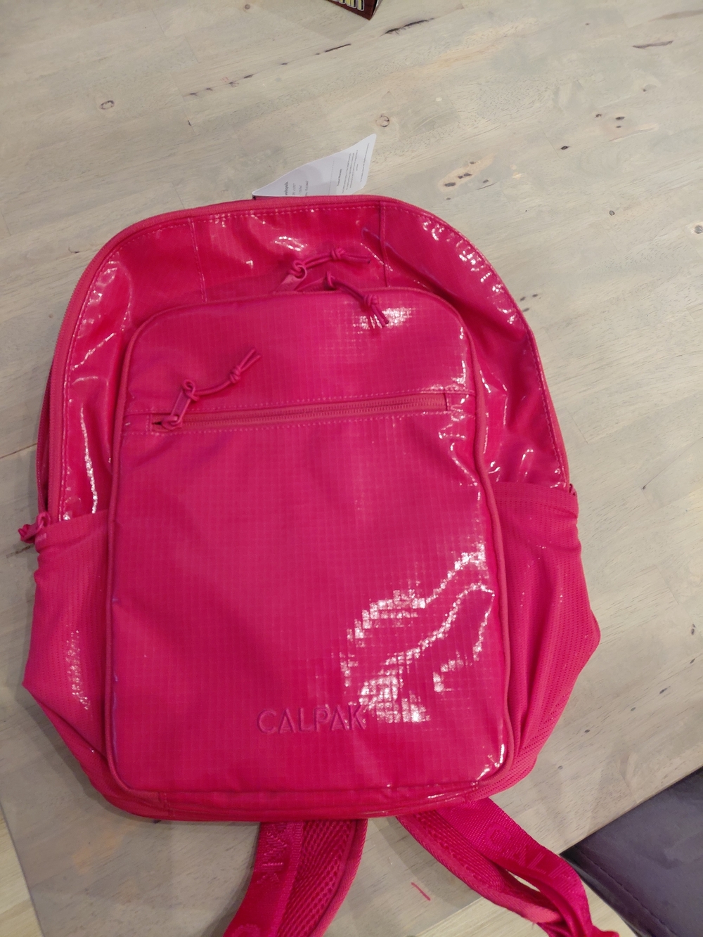 Calpak Hot Pink Gloss Backpack with Glossy Finish